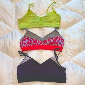 3 Alo sports bras. Green, pink and purple